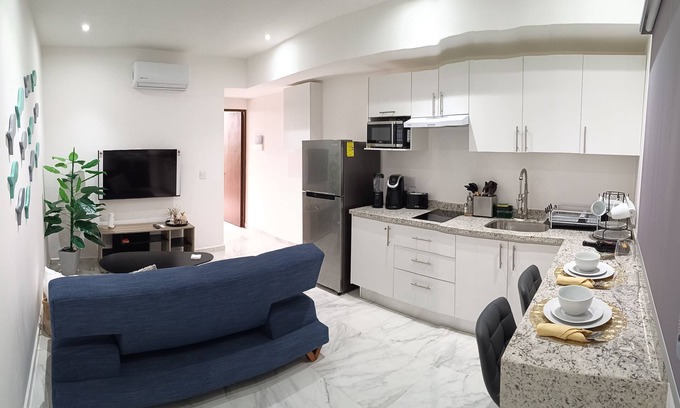 Playa del Carmen Apartment | Modern vacation apartment with gym, jacuzzi, rooftop pool and sauna.