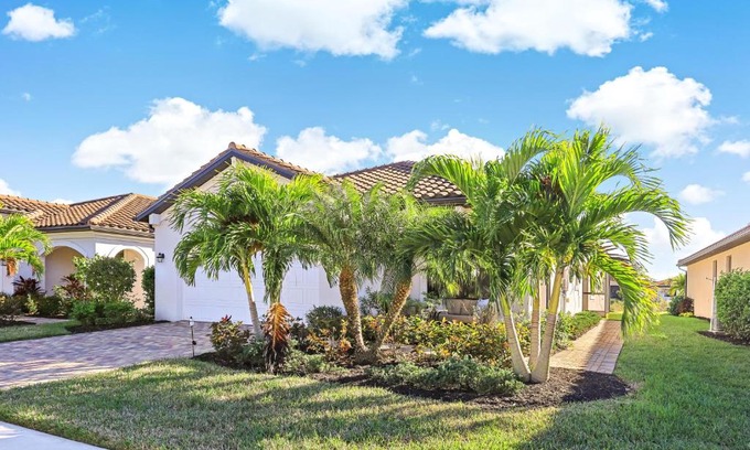 Naples House | Modern waterfront home in Artesia with pool/gym