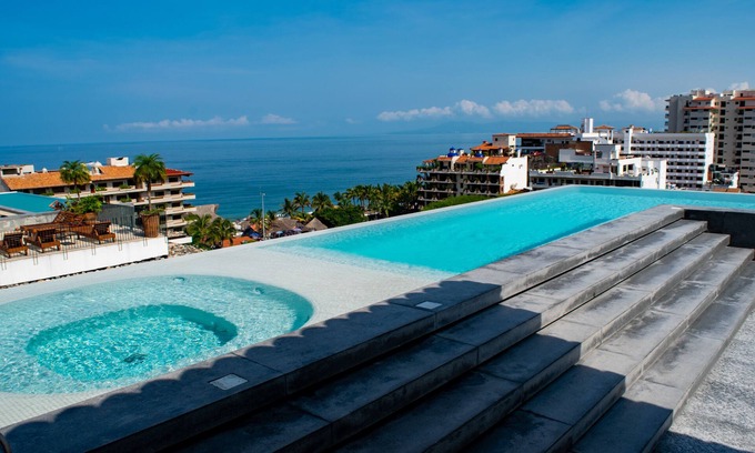 Emiliano Zapata Condo | New 2 BR condo, 5 min to the beach. Amazing ocean views from rooftop with pool!