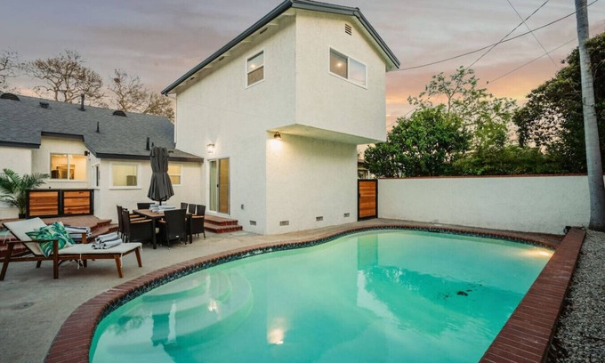 The Plaza House | *New* modern pool home + 5 mi to beach + sleeps 14