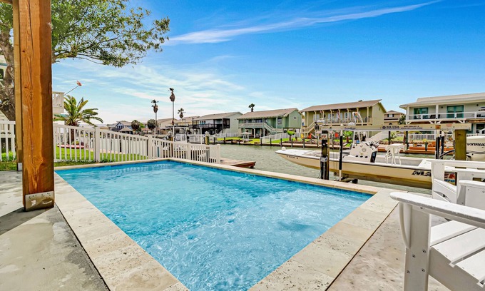 City-by-the Sea House | Newly constructed, canal-front home with private dock, covered deck, pool & W/D