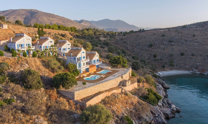 Galaxidi Villa | Nisaia is a villa with a small garden with barbeque next to the sea.