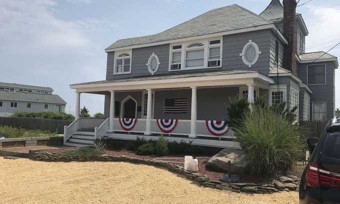 Long Branch House | Ocean Front Beauty with Private Beach, Grass Yard, Beach Volleyball and. More!