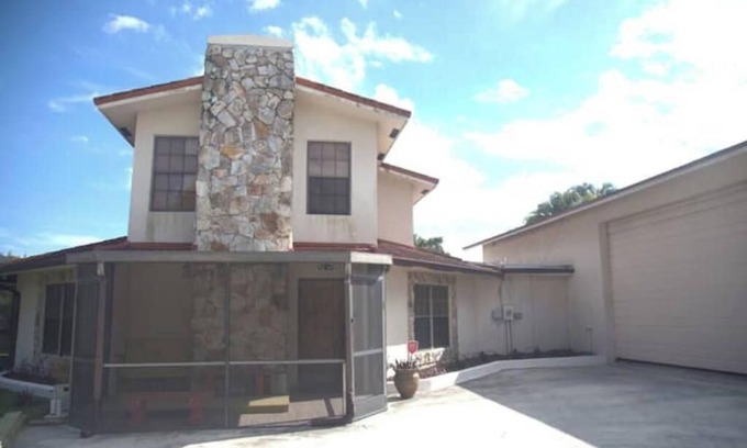 West Palm Beach House | Octagonal 2-story West Palm waterfront home w/dock, boat ramp, & private parking