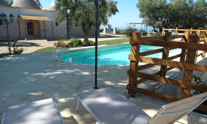 L'Assunta Villa | Panoramic trulli for 7 people in the hills with exclusive swimming pool 8 km from the sea