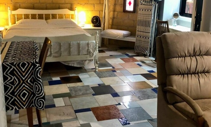 Bonny Hills Condo | Pet friendly covered courtyard with private studio