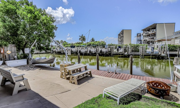 Goodland House | Private Dock, Boats & Bikes Charming Canal-Side Condo w/Screened Porch