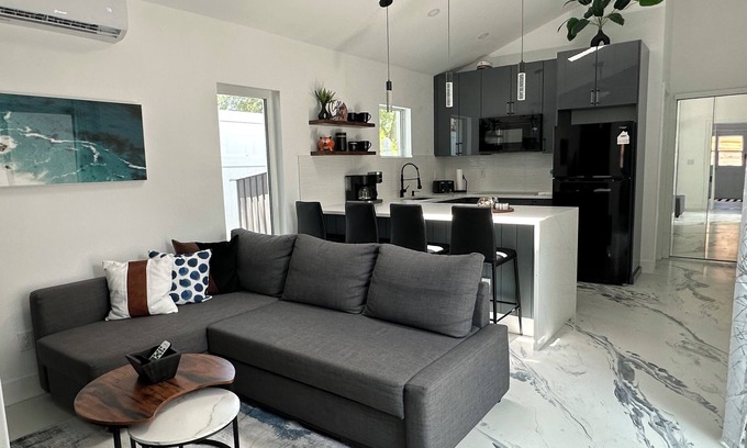 Bay Acres House | Private guest house with king bed & loft. Deck with hot tub and putting green