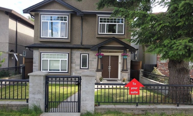 Metrotown Apartment | Private Suite with King Bed. Ground Level