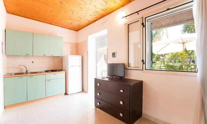 Chiesiola Resort | Property in a Holiday Village 'Baia Falcone - Comfort 210' with Sea View and Air Conditioning
