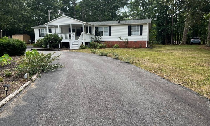Bracey House | Relax at this Golf Community House with nearby water access!