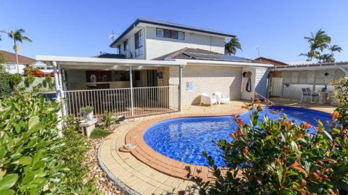 Sandstone Point House | Relax & Unwind Poolside Paradise