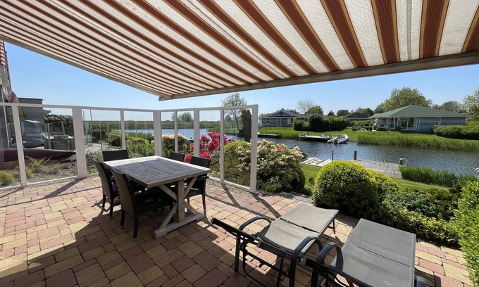 Makkum House | Renovated holiday home with its own jetty, sauna, internet