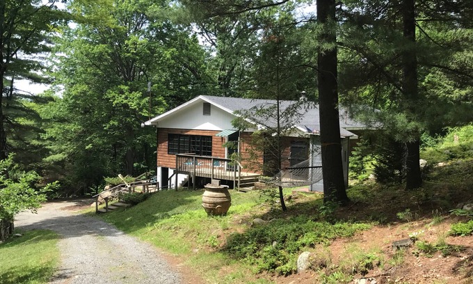 Northville House | Retreat into the woods and discover peace. And a hot tub with a view