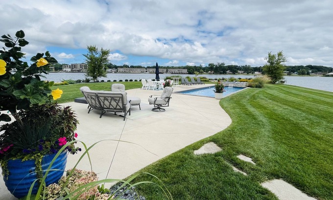 La Porte House | Retreat on the point of Pine Lake with your own pool/ hot tub.