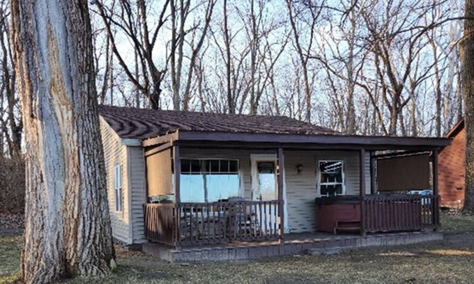 Colton Cottage | Riverfront Cottage with Hot Tub, Kayaks, Canoes, & Fishing Boats!