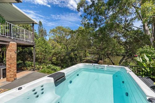 Elanora House | Riverfront Oasis in Elanora