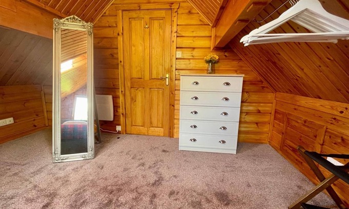 Aberchirder Cabin | Riverside Lodge—3-Bed Retreat in AberdeenshirenCozy, scenic, and peaceful.