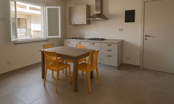 Sant'Antioco House | Sant Antioco Yellow Apartment with 2 Way Air Con