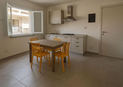 Sant'Antioco House | Sant Antioco Yellow Apartment with 2 Way Air Con