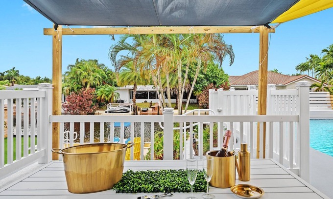 Lauderdale Isles House | Secluded Canal Sanctuary: Private Beach, Boat Dock, Pool, Mini-Golf Extravaganza