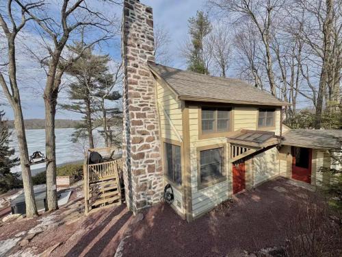 Lake Harmony House | Secluded Lakefront Cabin with Hot Tub and Views
