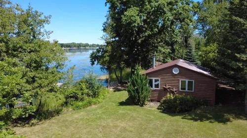 Little Sturgeon House | Secluded Waterfront Cottage with Kayaks and Fire Pit