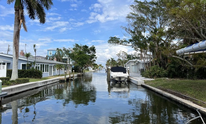 Whitney Beach House | Short walk to beach or take your boat from the canal /dock in your backyard!