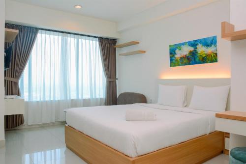Pekayon Jaya Apartment | Simple Studio Apartment at Grand Kamala Lagoon By Travelio