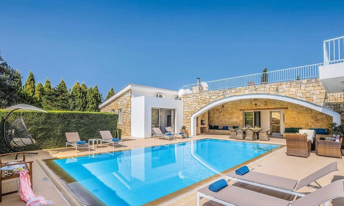 Giolou House | Situated in the inland region of Miliou, this stylish villa (which is next door to its sister villa