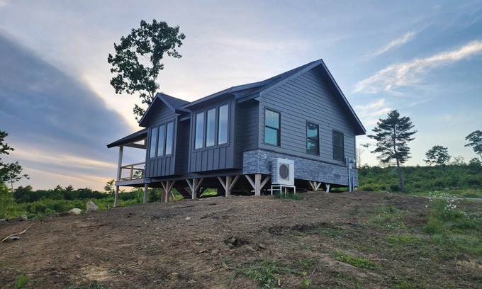 Brooks House | Small cottage house, centered on 100 acres surround by hills, lake, and cattle.