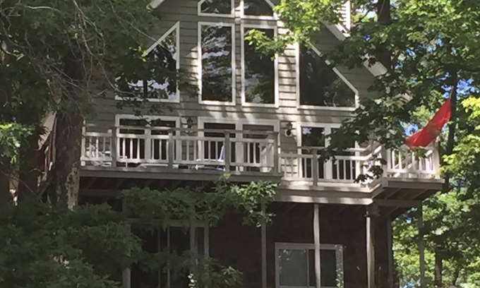 Fountain House | Spacious lakeside house on deep, all sports lake near Ludington & PM river
