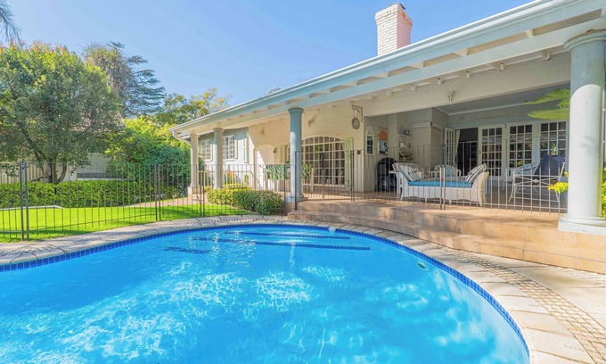 Greater Johannesburg Metropolitan Area House | Spacious Manor with Cozy Fireplace, Garden & Pool