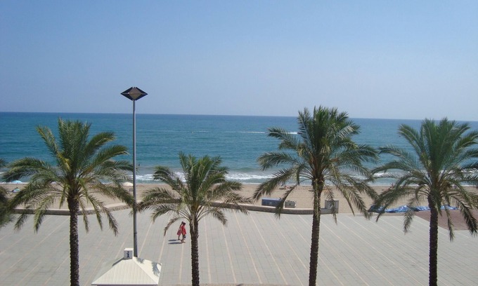 Calafell Apartment | Spacious seafront apartment overlooking the the beach with WIFI, parking & lift