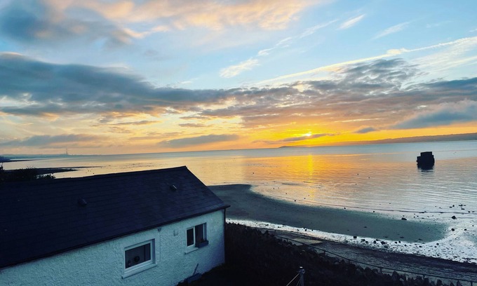 Whiteabbey Cottage | Stay beside the sea - Coastguard Boathouse - self contained cottage.