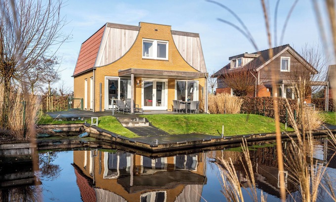 Akkrum House | Stay in our spacious Sneekermeer 6 home with private jetty.