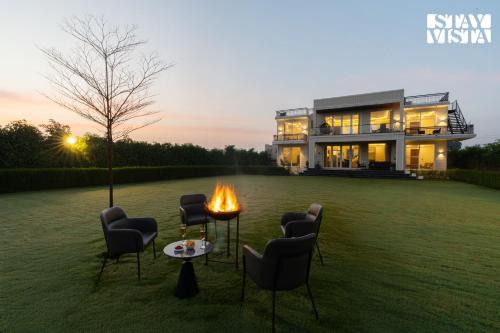 Gurugram Villa | StayVista at Olive Farms with Lawn, Pool, Bonfire & Hill Views