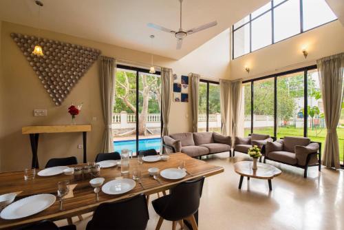 St.Stanislaus Villa Villa | StayVista's Greenwoods Villa 10 - City-Center Villa with Private Pool, Terrace, Lift & Carrom Board