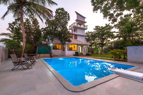 Vaijanath Villa | StayVista's Santoni Farms - Riverside Bliss with Pool, Orchard & Activities