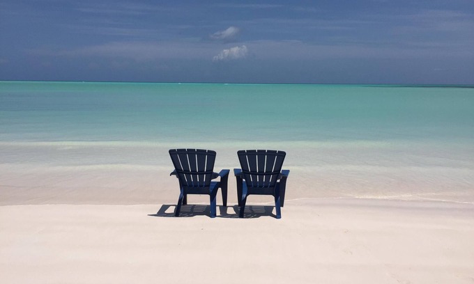 Spanish Wells House | Step from your porch onto the soft white sand & crystal clear water.
