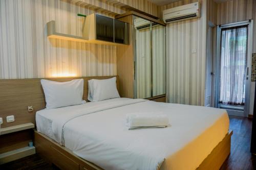 Pluit Apartment | Studio Furnished with Comfort Design Green Bay Pluit Apartment By Travelio