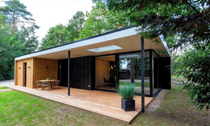 Maasbree House | Stylish eco-cottage in a forest setting with covered terrace, modern kitchen and ideal for families who love nature and comfort.