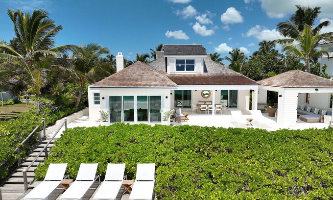 Dunmore Town Villa | SUNNYSIDE - Steps to the Sea! Barefoot luxury on World-Famous Pink Sand Beach!