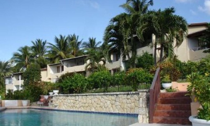 Dickenson Bay Apartment | Swimming Pool- Balcony Veranda- Sea & Sunset Views