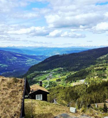 Nord-Aurdal House | Tømmerhytte i Valdres med panoramautsikt over fjellene