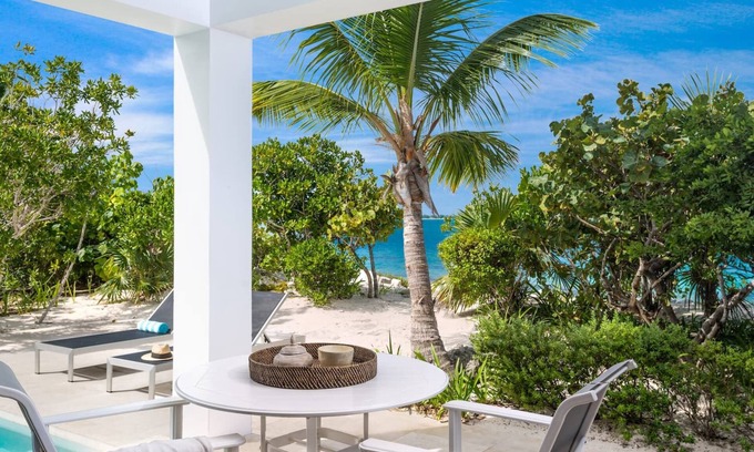 Providenciales House | TC Villas -Water Edge Villa -Beachfront on Grace Bay Beach