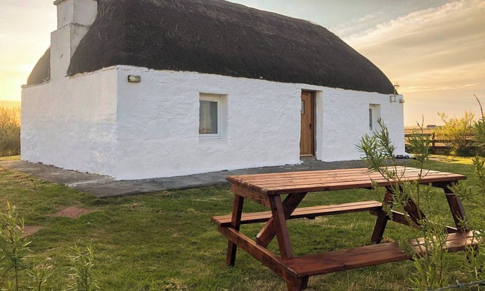 Benbecula Cottage | The cottage is so attractive with its traditional thatch and whitewashed walls.