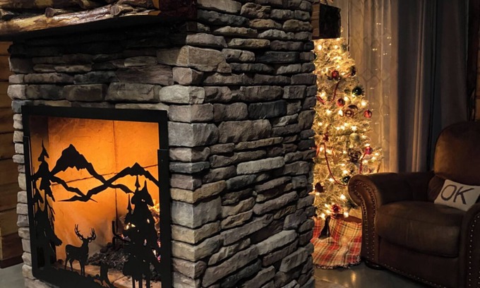 Tishomingo Cabin | The Cozy Pines is a newly built, romantic log cabin with a 2-sided fireplace.