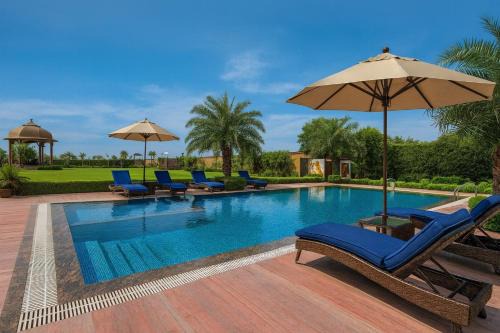 Harda Hotel | The Ginger, Vrindavan #Big Swimming Pool #luxury Rooms # Lush Garden # Family Friendly # Kids Play Zone # Calm & Spiritual Vibes # Away From City Hustle# By elegance group#