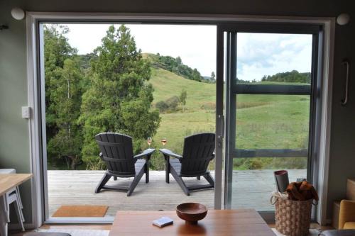 Te Anga Villa | The Rimu Hut - Off-grid Luxury riverside cabin